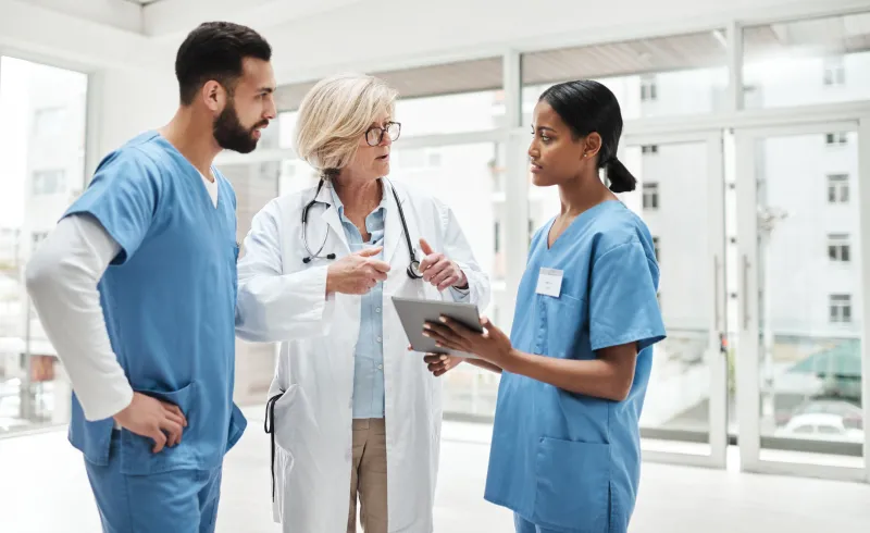 Shot of a group of medical practitioners having a discussion in a hospital.