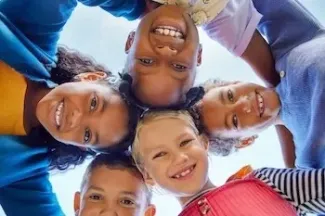 Five children huddled together